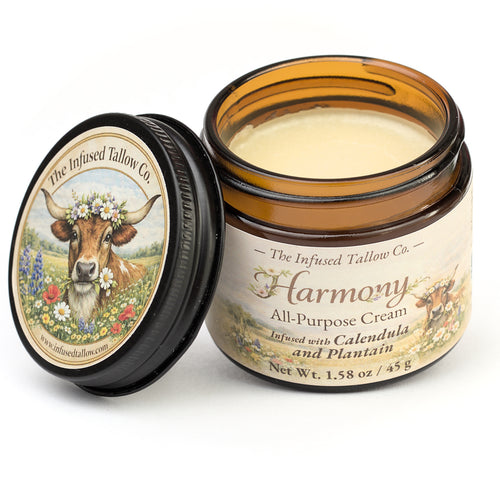 Harmony All-Purpose Cream open jar with the cream visible and lid set beside it