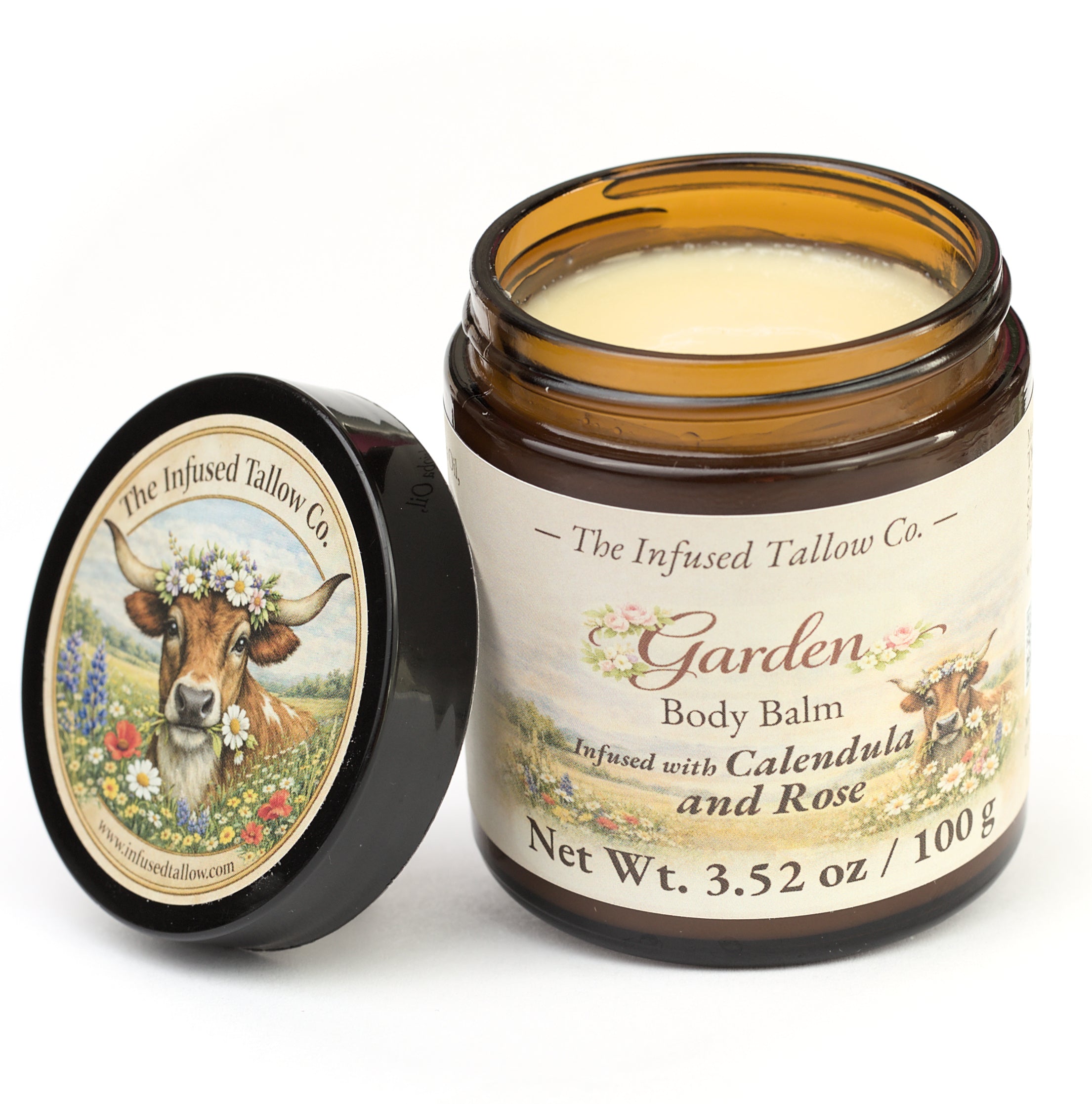 Garden Body Balm open jar with the balm visible and lid set beside it